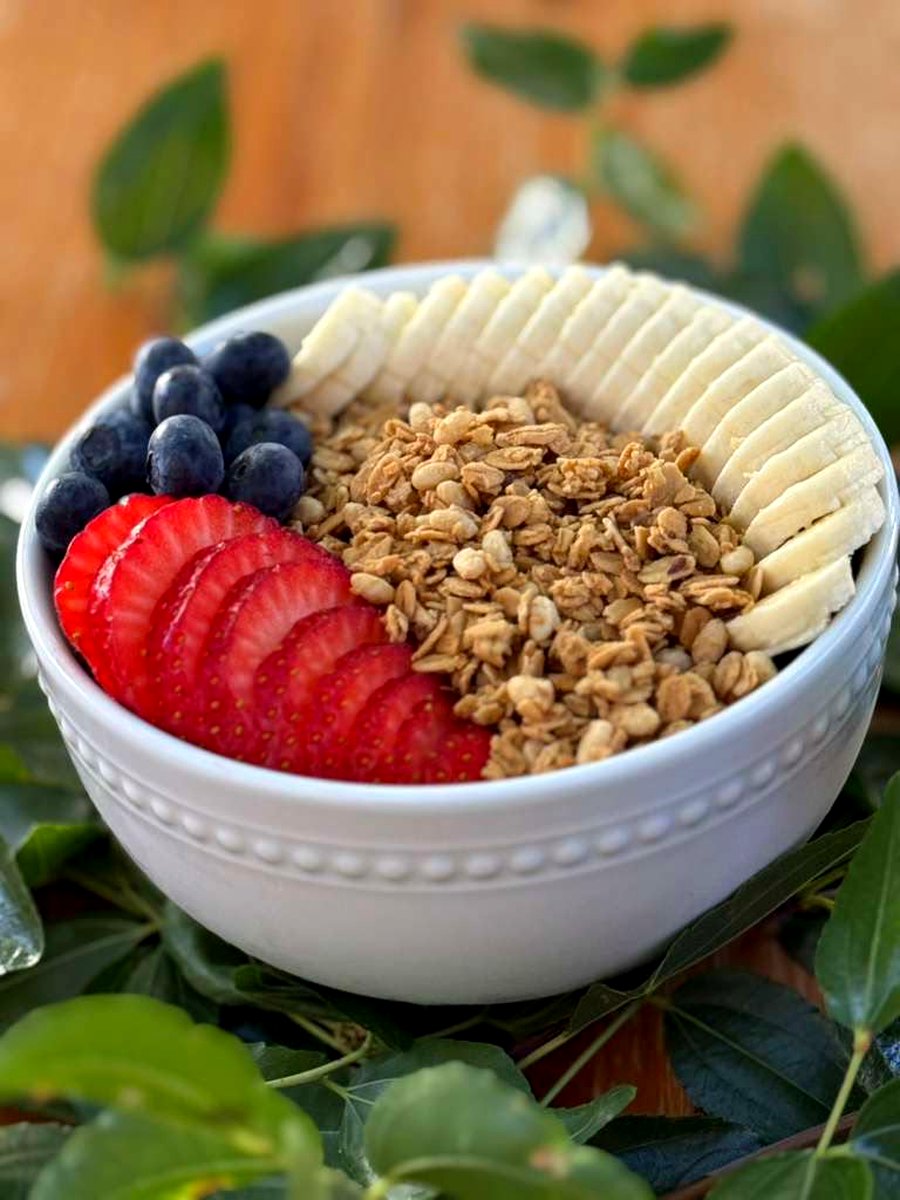 Creamy açaí bowl piled with fresh fruit and granola